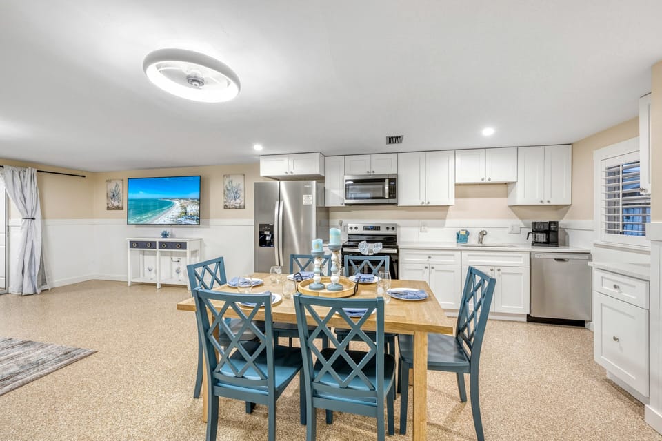 Balanced layout with dining table centered in the space.