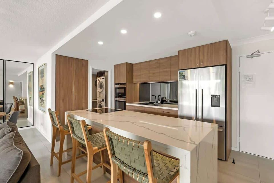 Pull up a seat at the kitchen island, perfect for casual bites or conversation while meals come together.