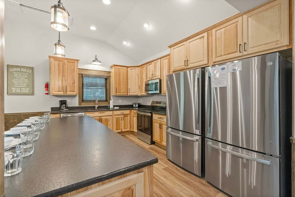 The Sleek and Modern 2nd Floor Kitchen with 2 Fridges, plenty of prep space and new appliances.