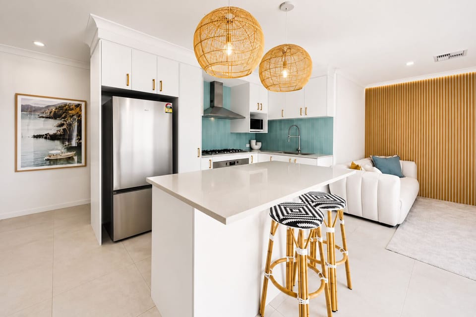 Open Plan Kitchen : The kitchen island at The Duchess of Duke adds bench space and two stools, tying the kitchen into the open-plan dining area.