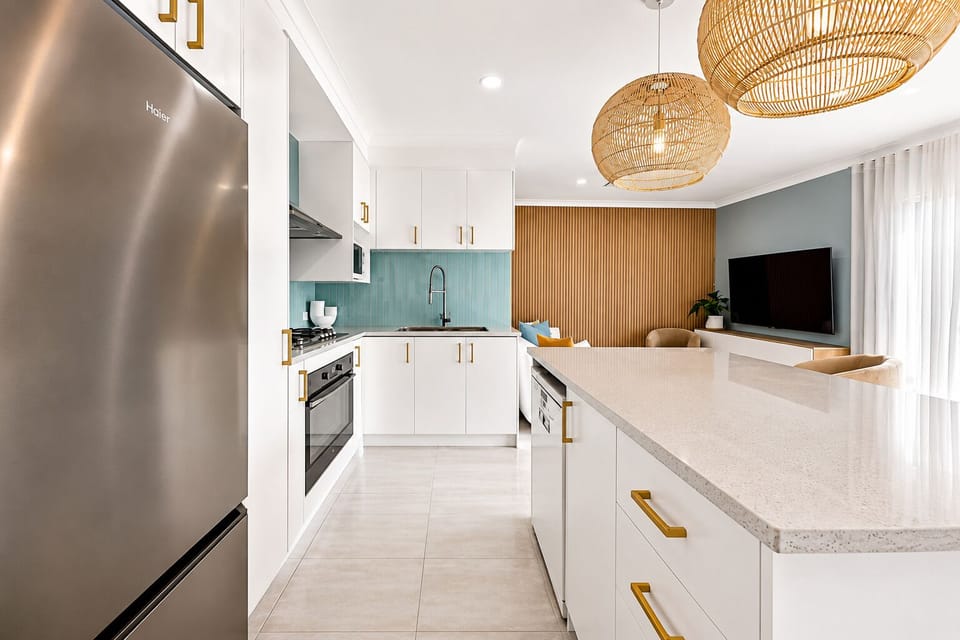 Kitchen : Fully equipped kitchen at The Duchess of Duke, with gas cooktop, oven, microwave, dishwasher, fridge, kitchenware, wine glasses and a connected dining layout.