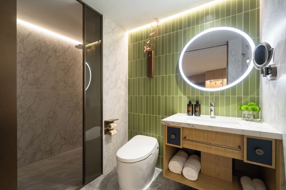 Family Suite, City View | Bathroom | Shower, hair dryer, slippers, towels