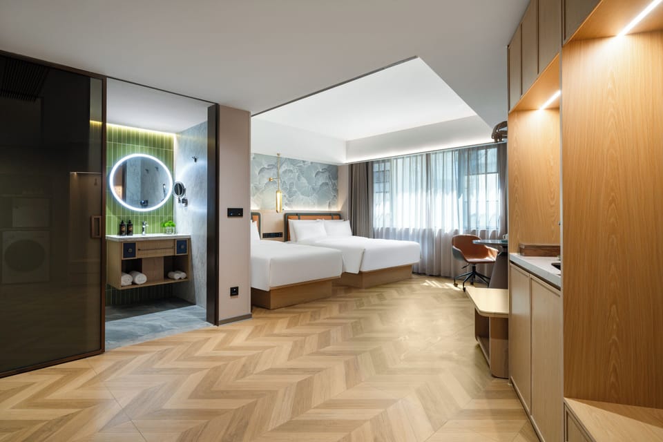 Family Suite, City View | Desk, laptop workspace, blackout drapes, soundproofing