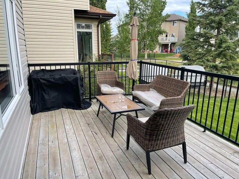 Shared backyard deck for guest relaxation & BBQ with Host