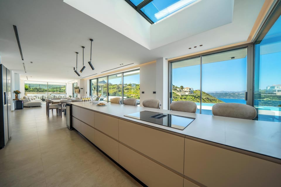 The fully equipped kitchen includes all modern appliances for a seamless self-catered stay, complemented by a skylight that fills the space with sunlight