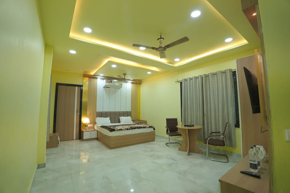 Standard Double Room, Balcony, Garden View | Laptop workspace, iron/ironing board