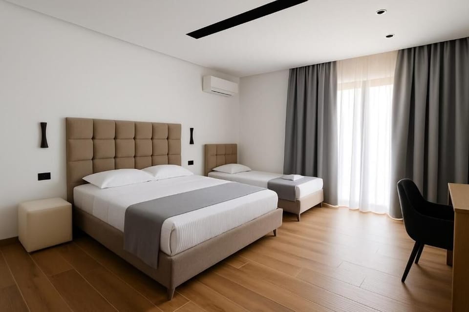 Triple Room, Balcony, Courtyard View | In-room safe, free WiFi