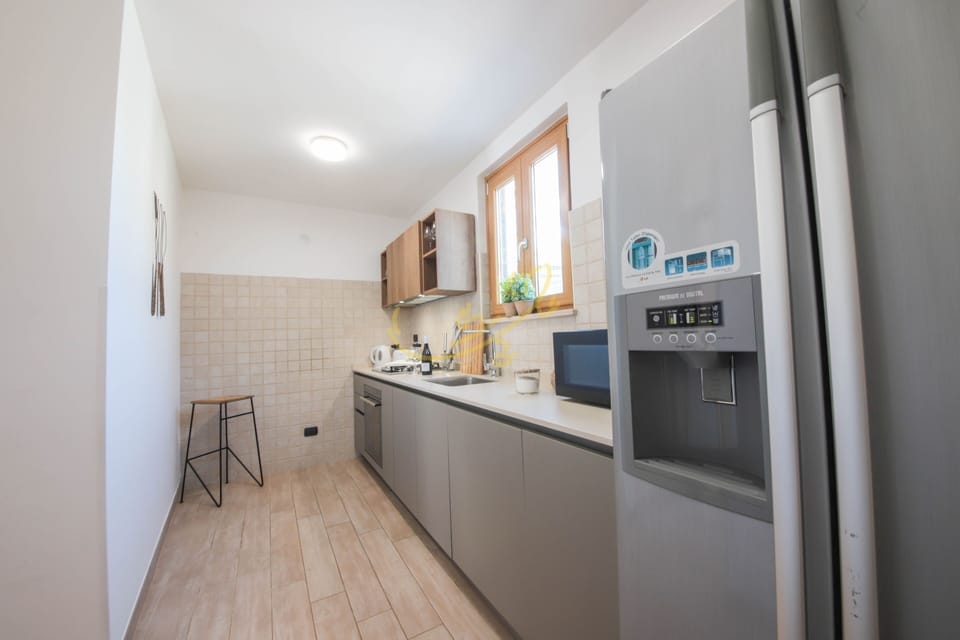 House (4 Bedrooms) | Private kitchen | Oven, electric kettle, highchair