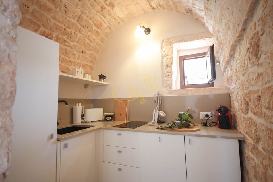 Villa (1 Bedroom) | Private kitchen | Oven, espresso maker, electric kettle, highchair