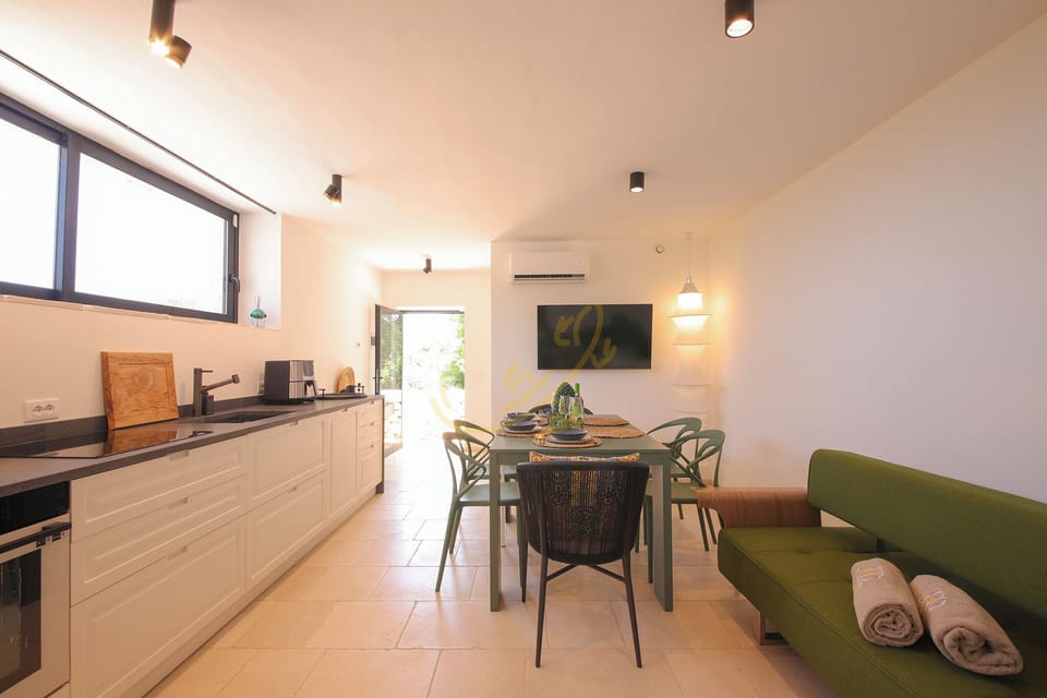 Villa (4 Bedrooms) | Private kitchen | Oven, espresso maker, electric kettle, highchair
