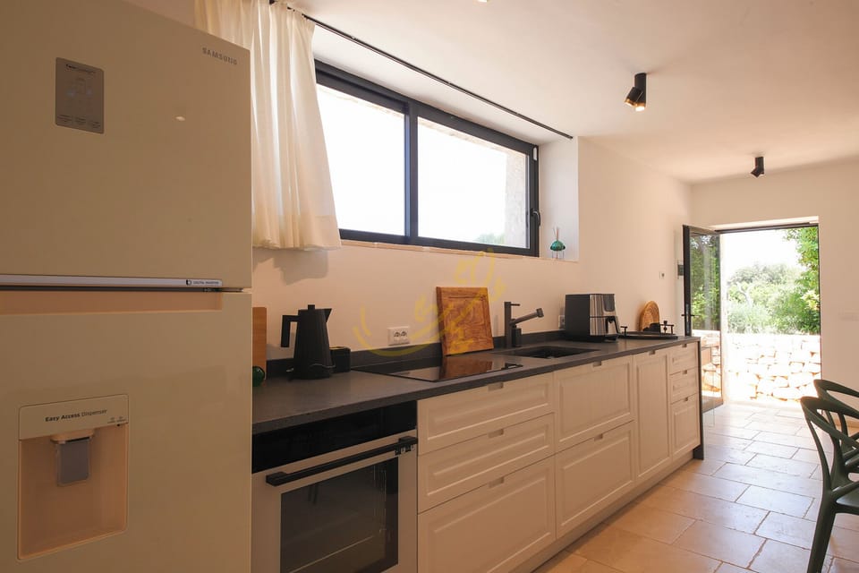 Villa (4 Bedrooms) | Private kitchen | Oven, espresso maker, electric kettle, highchair
