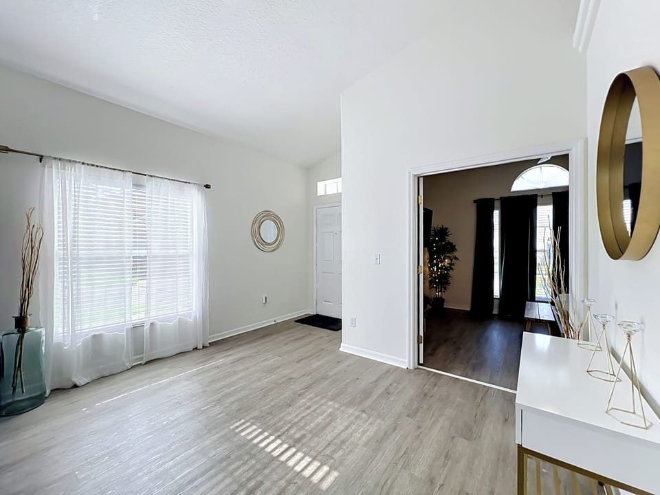 Fresh and airy interior with stylish laminate flooring throughout the home.
