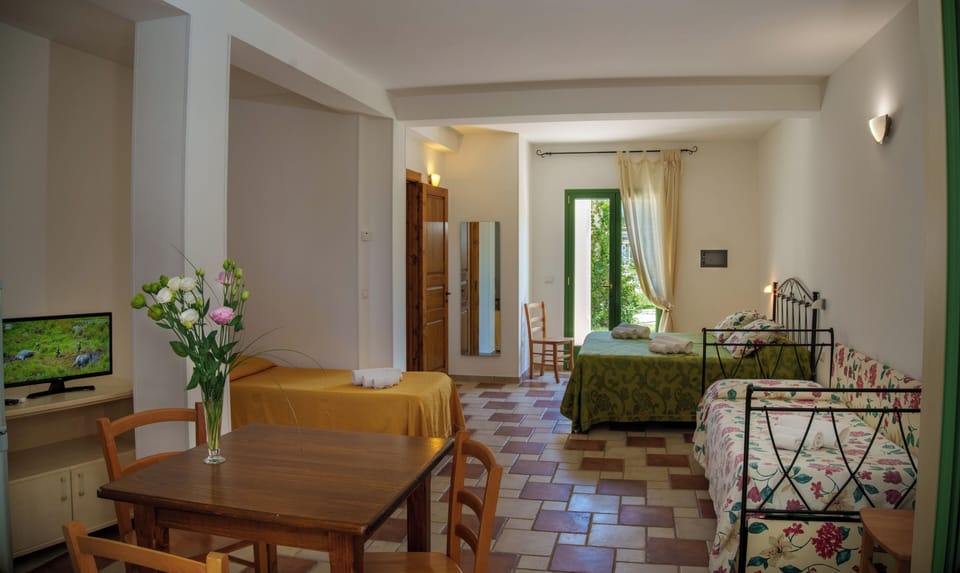 Family Quadruple Room, Pool View | In-room safe, desk, free WiFi, wheelchair access