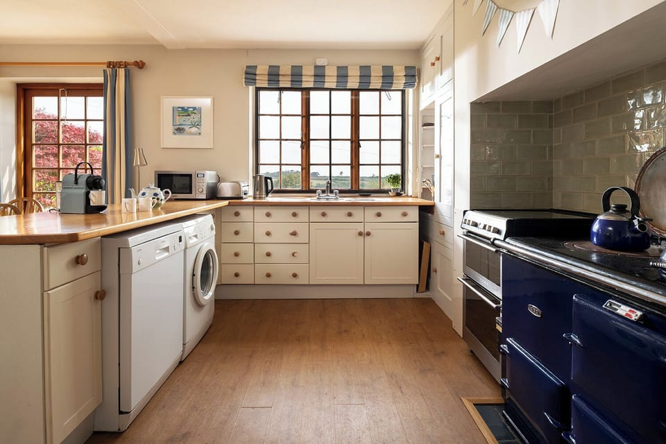 Kitchen - electric oven/hob, dishwasher, fridge/freezer, microwave.