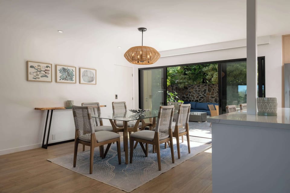 Dining opens directly to the private back lanai through wide sliders — true Maui indoor/outdoor living, anytime you want it.