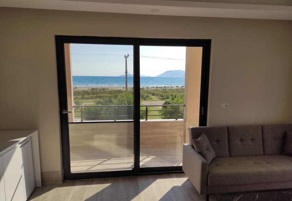 Classic Quadruple Room, Balcony, Partial Sea View | Living area
