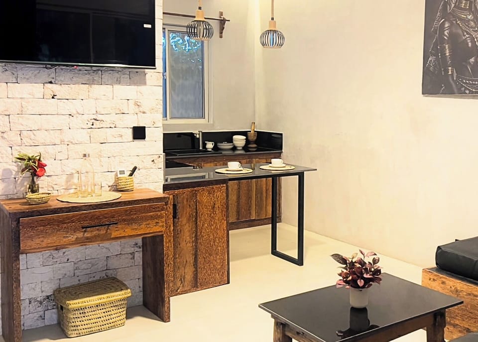 Deluxe Apartment, Pool View | Living area | 50-inch Smart TV with digital channels, streaming services