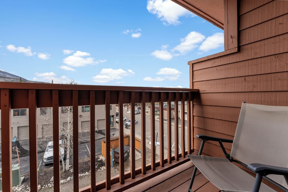 A private balcony with comfortable seating where you can relax under bright blue skies and enjoy the fresh mountain air throughout your stay.