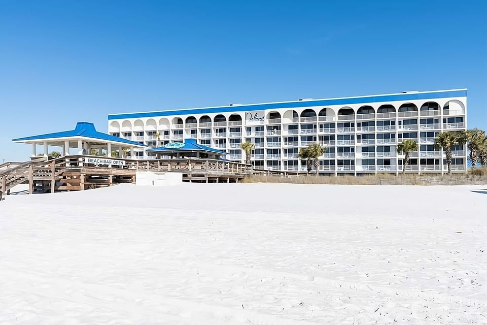 Sip something cold at the beach bar beside the sand.