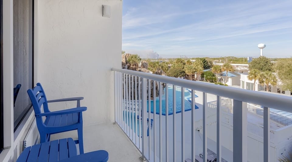 Sip morning coffee on the balcony overlooking the pool.