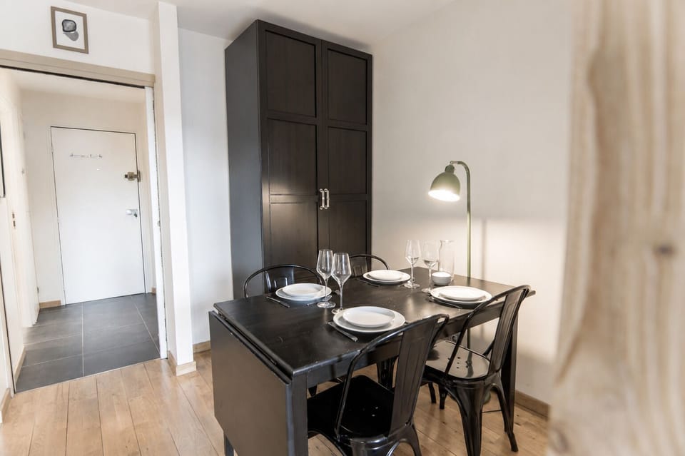 The dining area features an extendable table for added comfort and convenience.