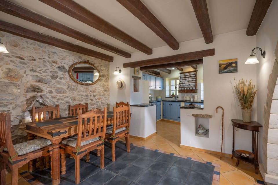 Stone wall, dining table, country light