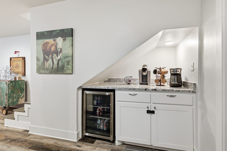 Coffee bar + beverage fridge. Bring your own pods/coffee grounds and filters- we do not supply these for sanitary purposes.