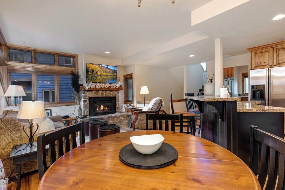 Share meals at the round dining table with seating for four and views of the outdoors.
