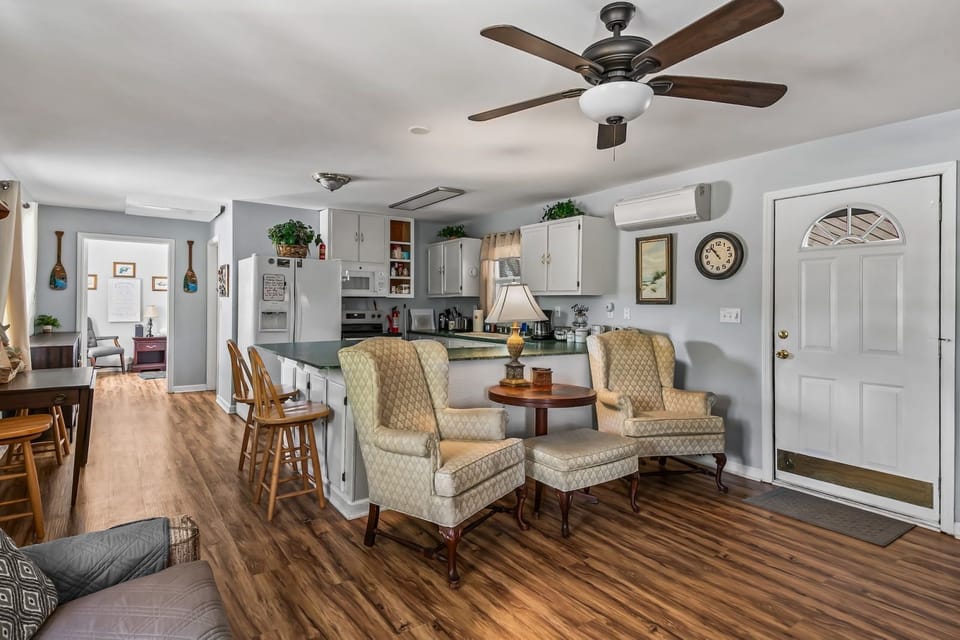 Living area lamp and plush seating — warm tones and simple decor keep the mood relaxed