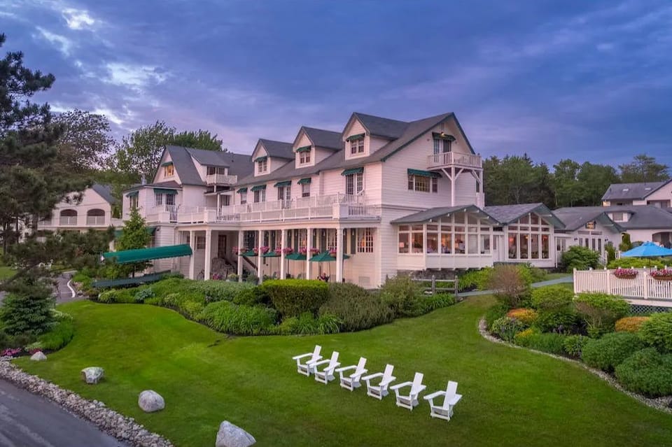 Unwind where timeless charm meets coastal calm, with sweeping porches and garden-lined views.