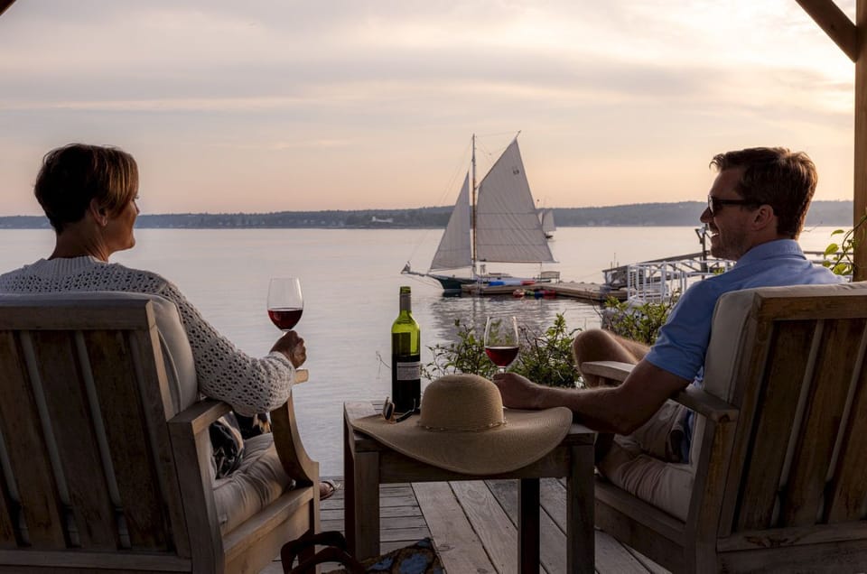Watch the day slip into evening with a glass in hand and the harbor aglow—moments like this were made to be savored.