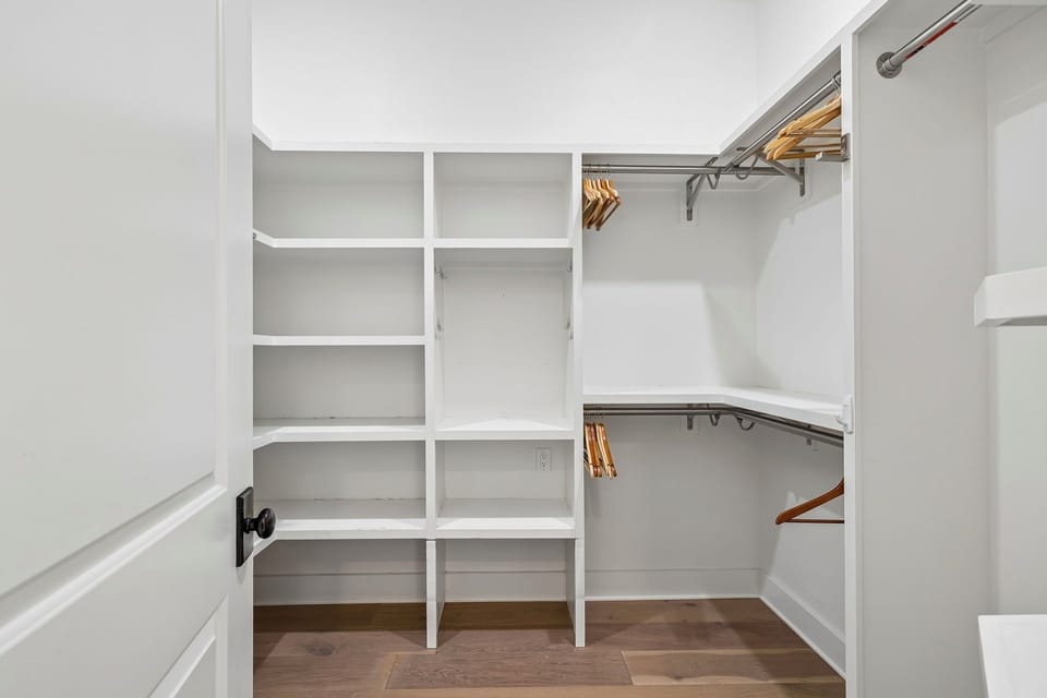 Your own walk-in closet with custom shelving and hanging rods, giving you plenty of space to unpack and settle in comfortably during your stay.