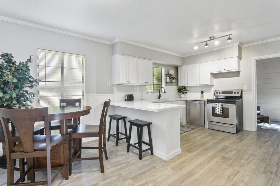 Gather in the spacious kitchen, complete with seating for six