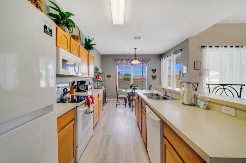Fully equipped kitchen with ample counter space and modern appliances.