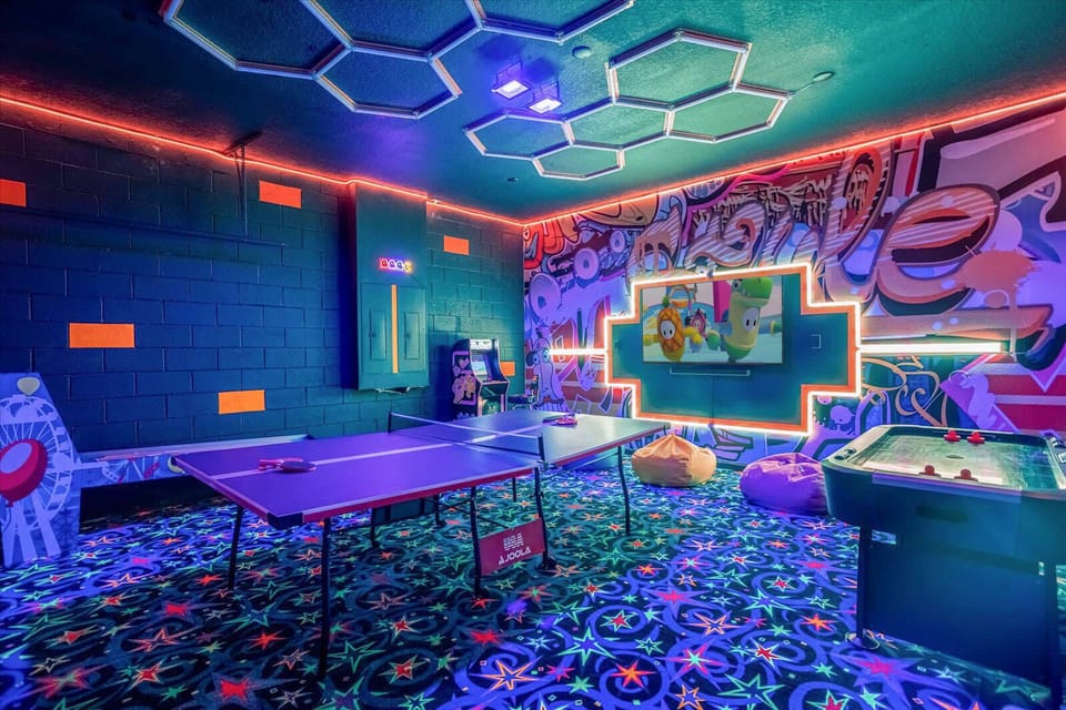 Garage-turned-games-room with cool accent lighting