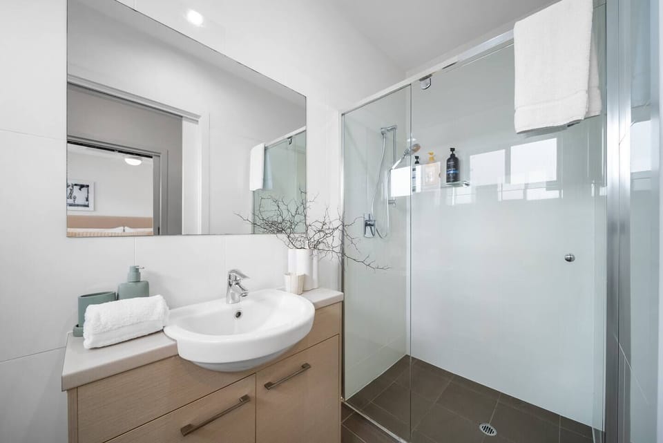 Refresh in the ensuite connected to the primary bedroom, where clean modern finishes and a walk-in shower create a bright and practical start to each day.