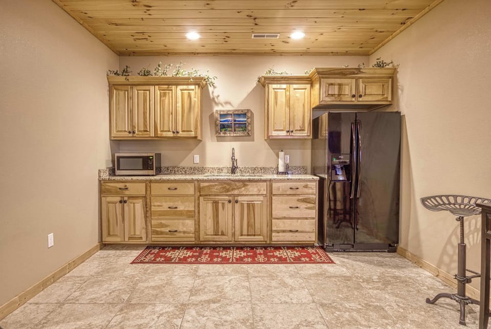 Gather for snacks and drinks with a convenient kitchenette space.