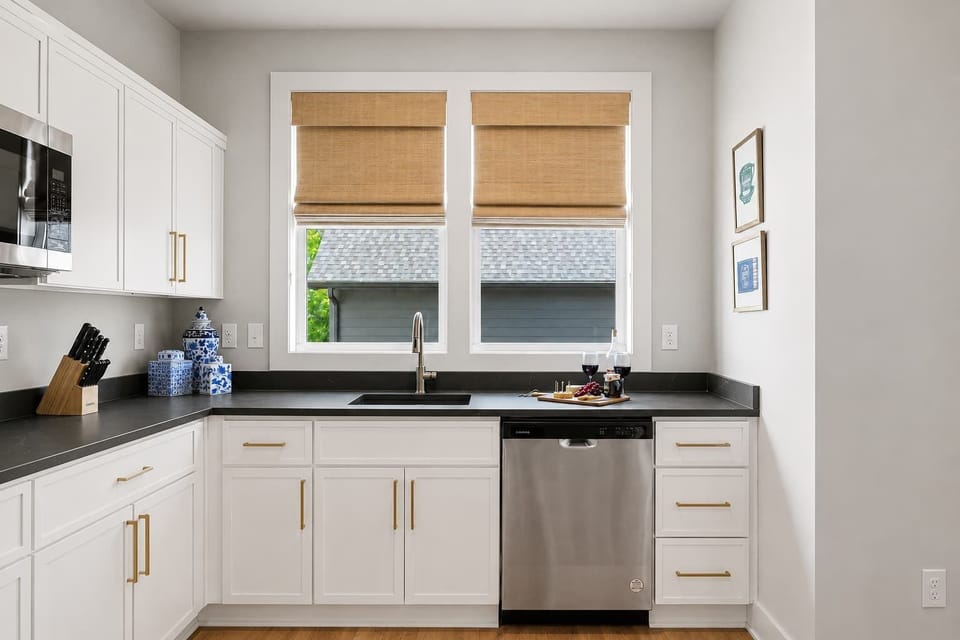 Modern kitchenette with stainless-steel appliances and plenty of counter space.