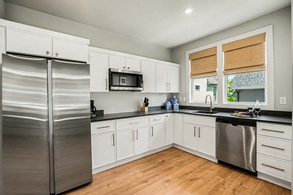 Modern kitchenette with stainless-steel appliances and plenty of counter space.