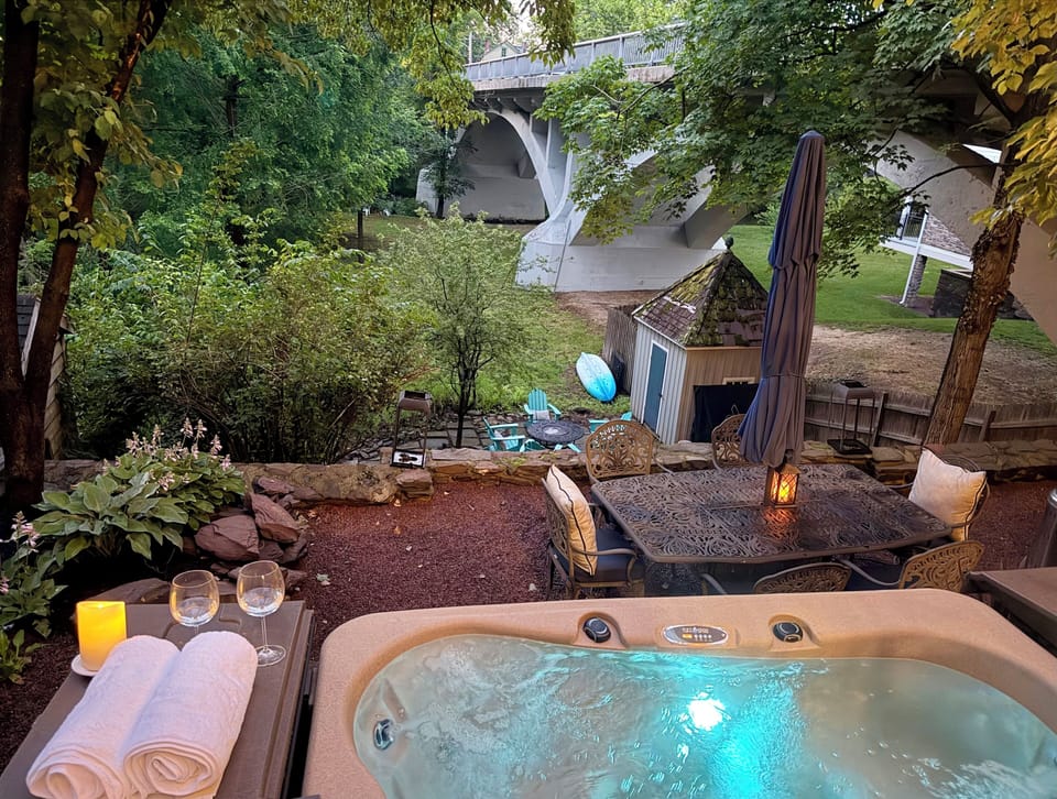 Outdoor - Relax in the private hot tub overlooking the terraced yard and creek.