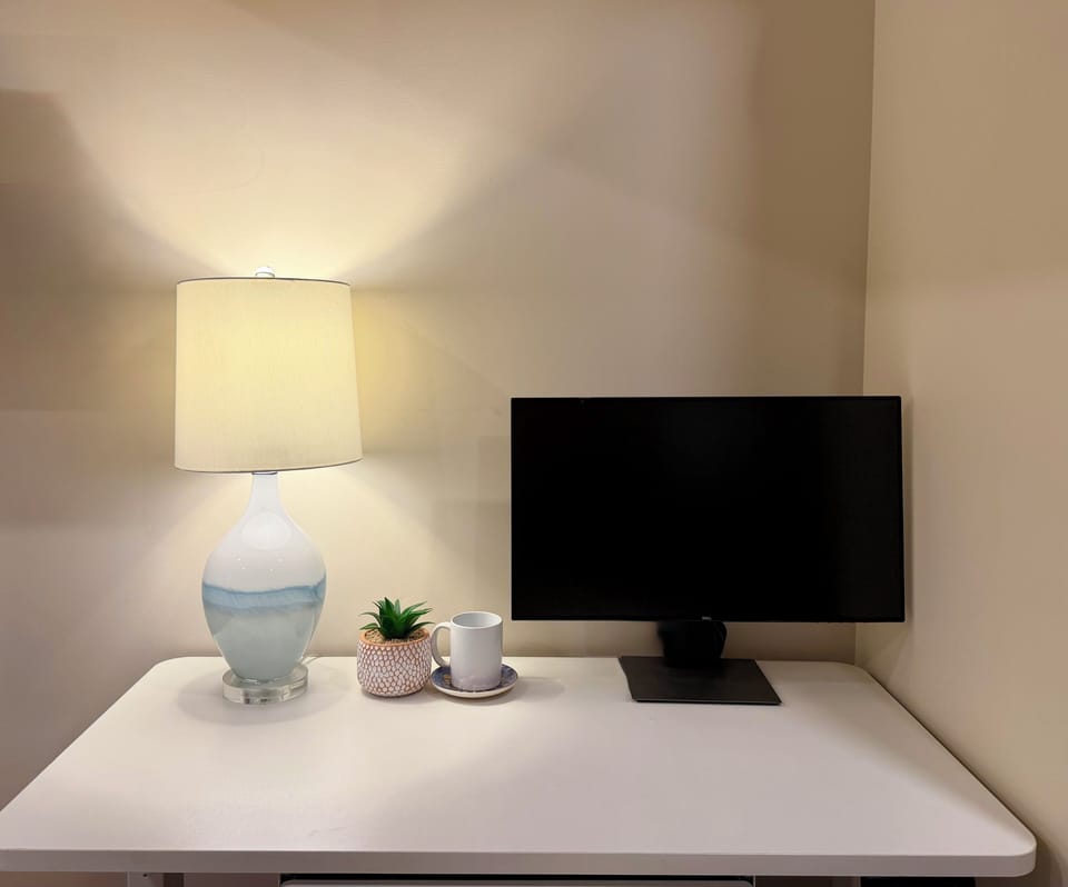 Need to catch up on work? Enjoy our adjustable-height desk, monitor, and Wi-Fi.