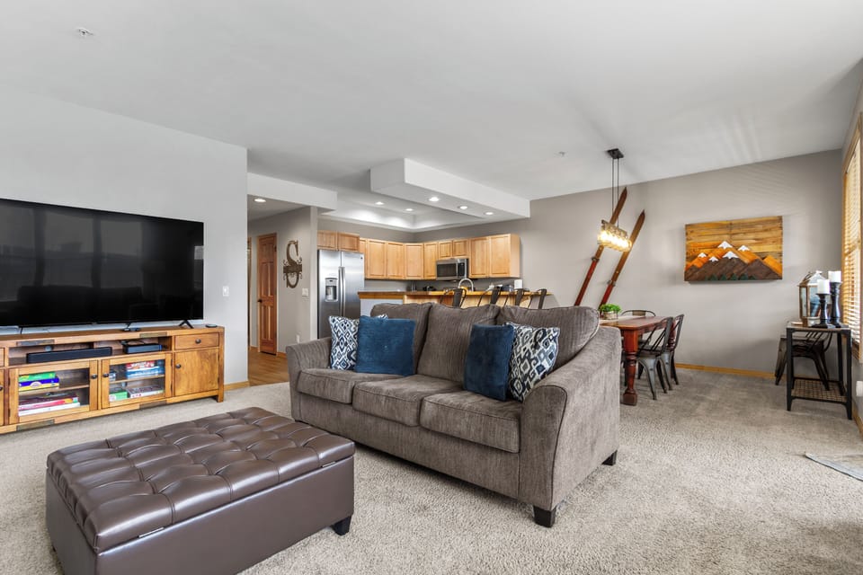 The heart of Alpine Base Camp — open living, dining, and kitchen spaces designed