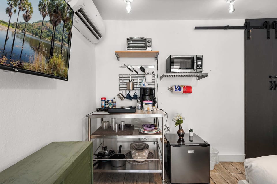 Prep quick meals or your morning brew in the stainless-steel kitchenette, equipped with a microwave, toaster oven, coffee maker, and mini-fridge.