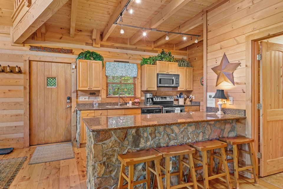Seating at the Kitchen Bar with a Stone Knee Wall