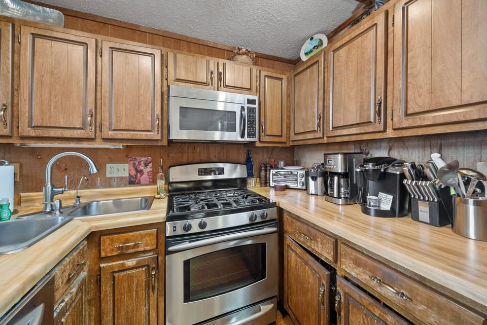 Gas Stove, Dual Basin Sink, and Well-Equipped Kitchen