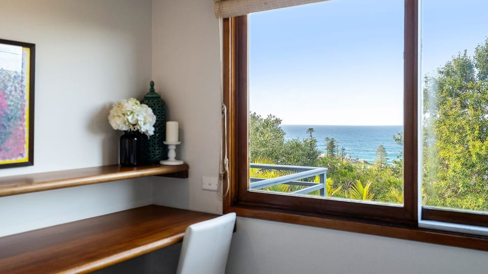 Ocean views and natural light create the perfect work-from-home setup.