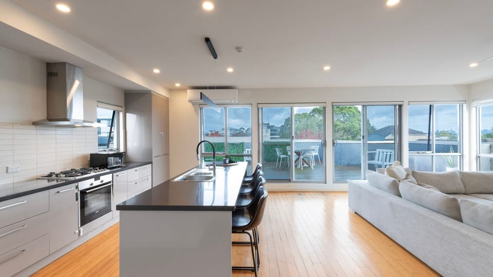 Kitchen Island and open floor living with patio access