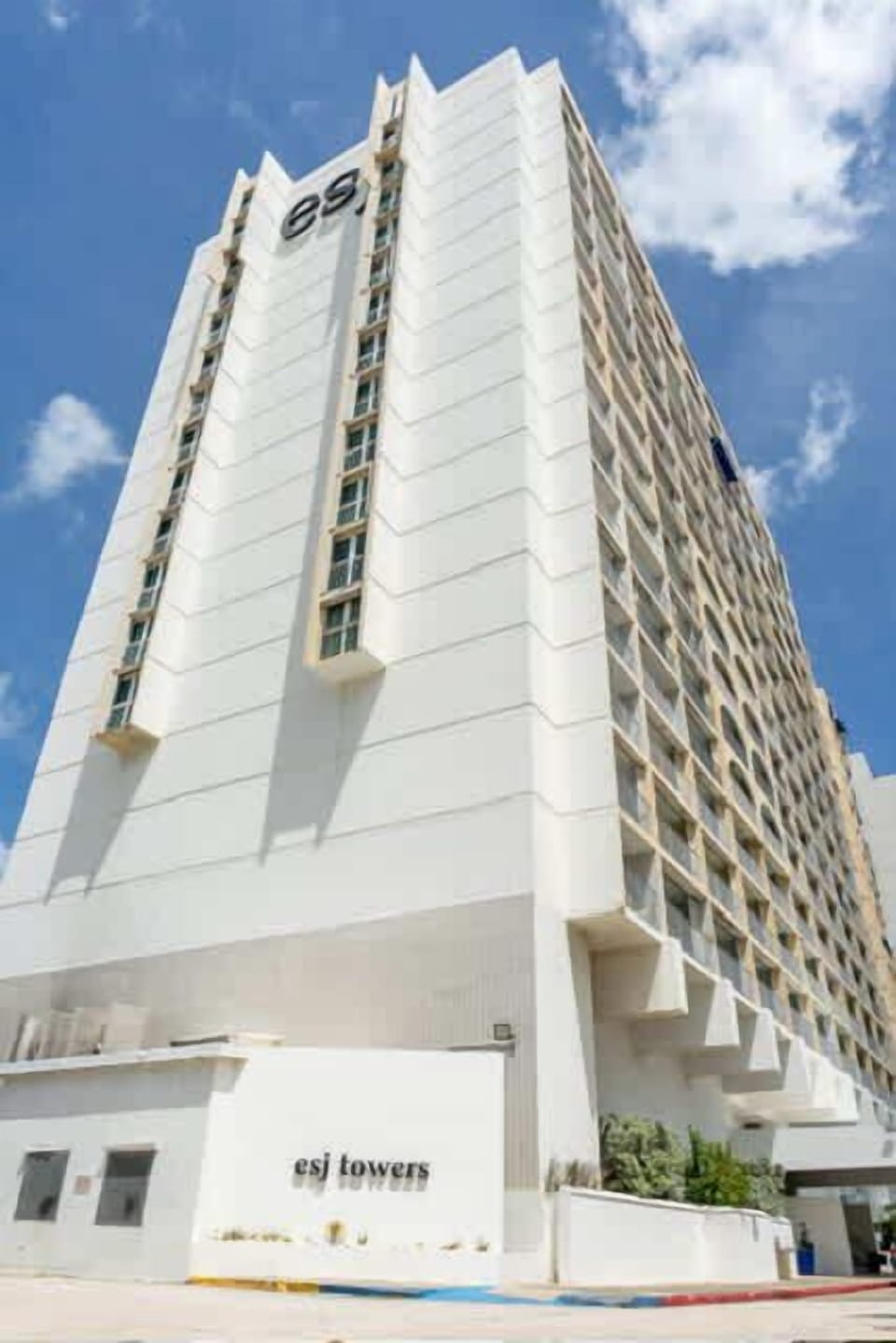 Bright high-rise ESJ Towers exterior showcasing contemporary architecture just steps from the beach, restaurants, and nightlife in Isla Verde.