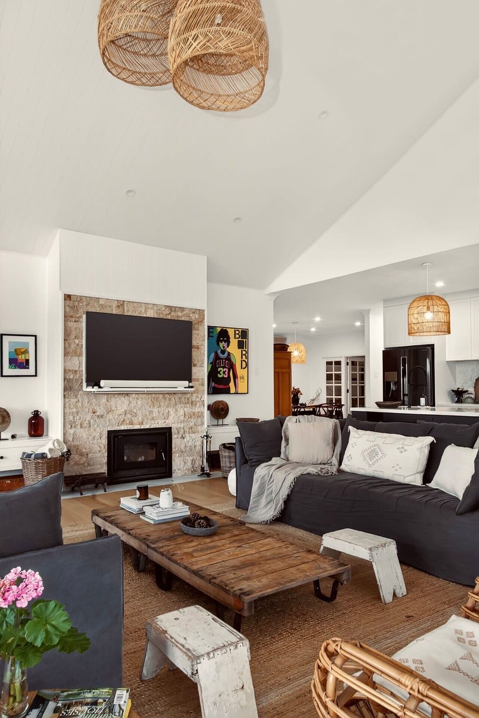 Bright open-plan living area with cozy fireplace and views.