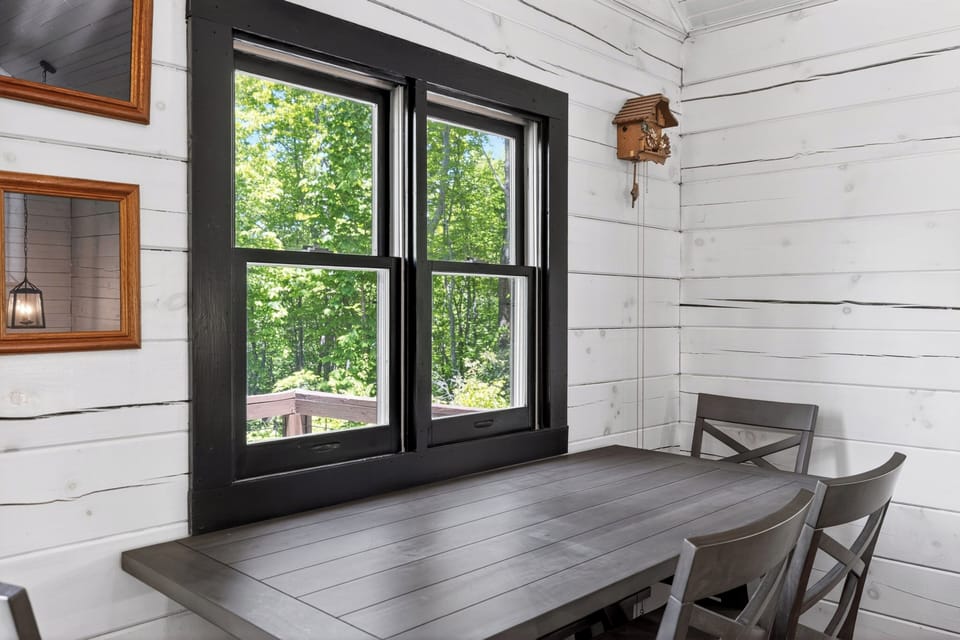 Enjoy your morning coffee at the dining table overlooking the private deck.